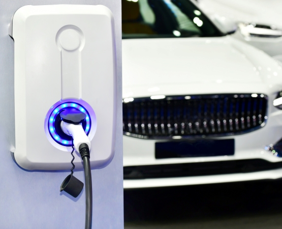 electric vehicle charging station with power supply plugged 1